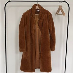 Women’s fuzzy fleece lapel open front teddy coat.